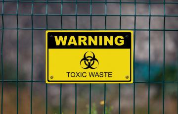 Image is of a Sign that Says Toxic Waste Warning. Source: Canva