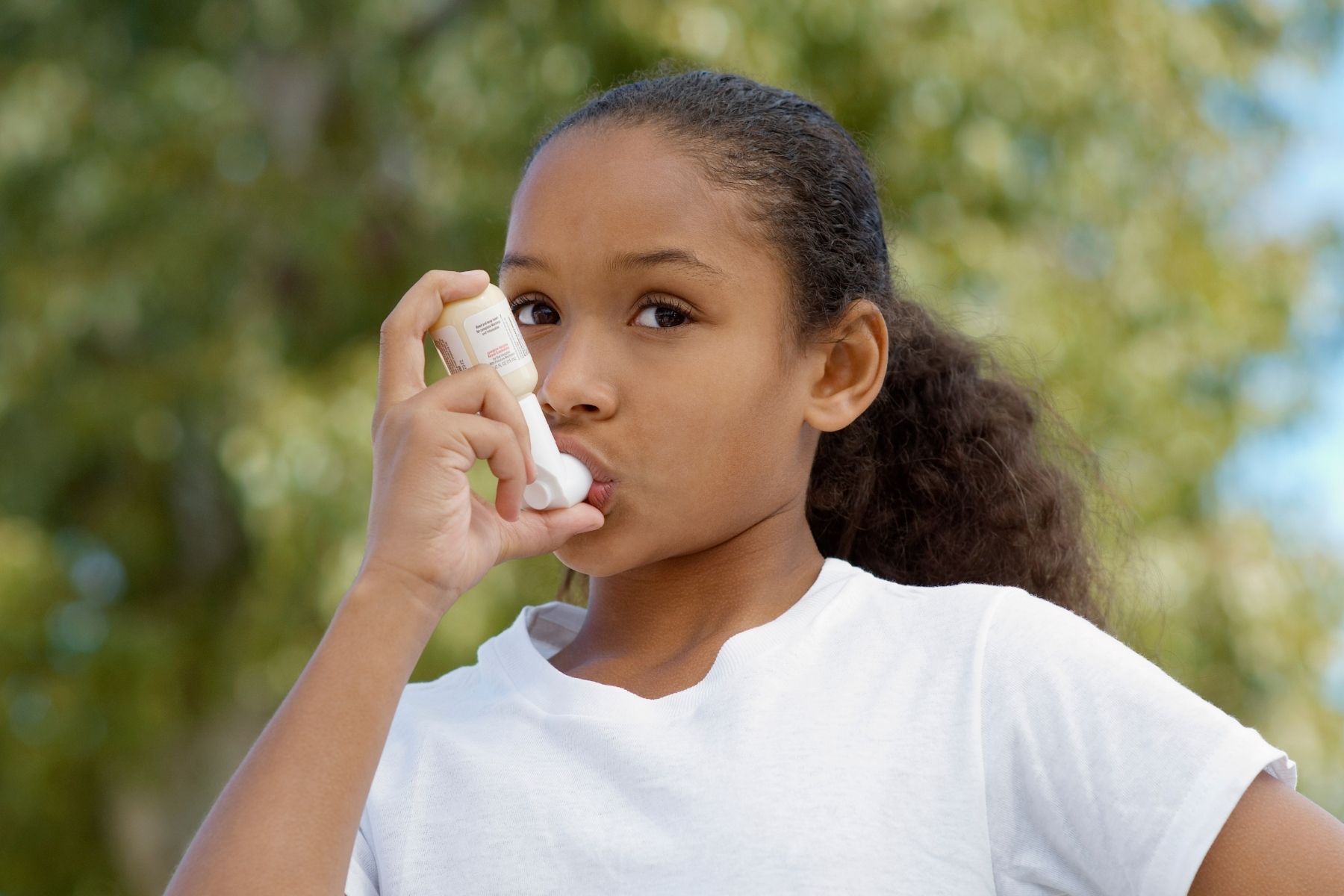 Young girl with inhaler