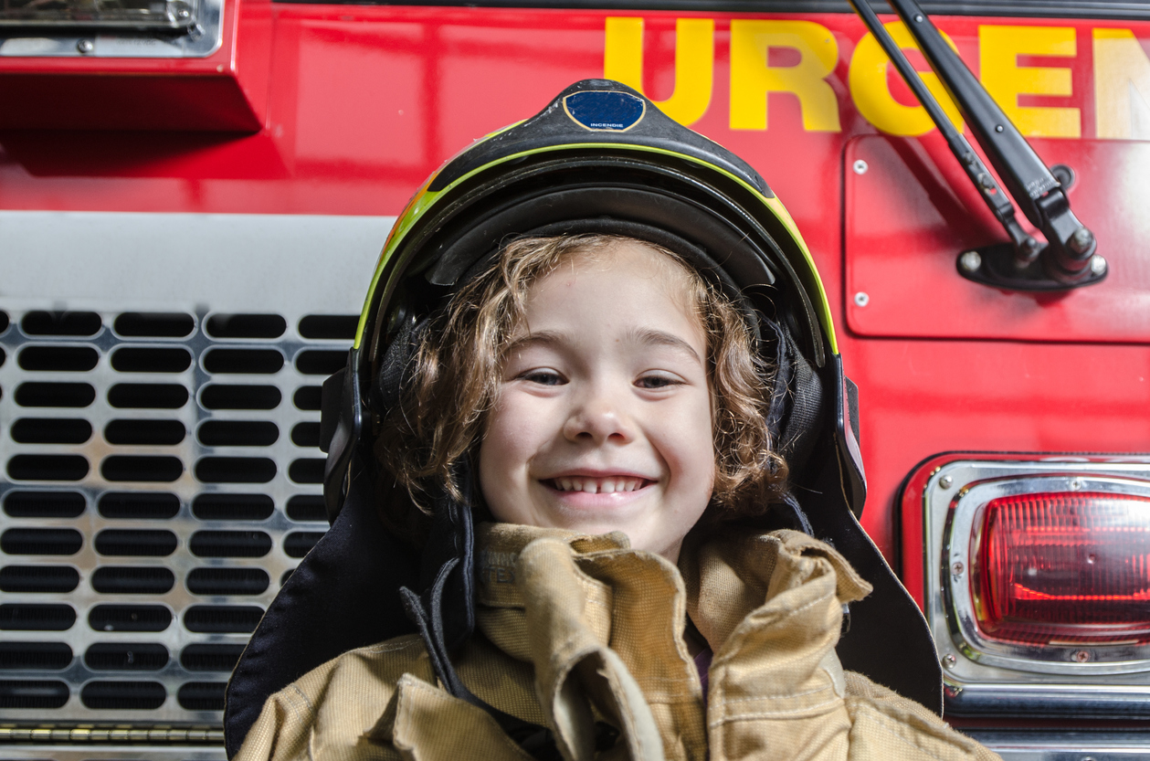 MA_istock_young-girl-wearing-fireman-coat-and-helmet.jpg