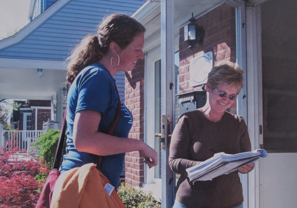 Clean Water Action field canvasser speaking to a member on her doorstep