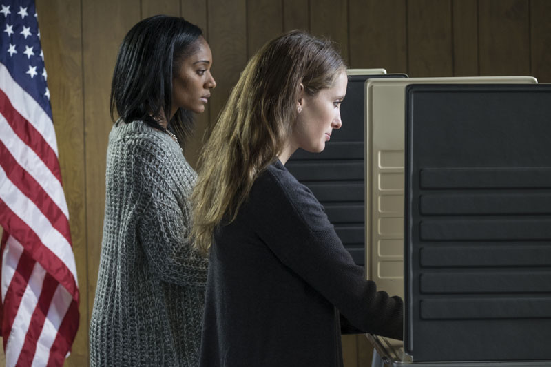 Two women voting. Photo credit: Burlingham / Shutterstock