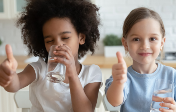 Children Giving Thumbs Up to Drinking Water