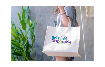 Image of someone holding a reusable bag - canva