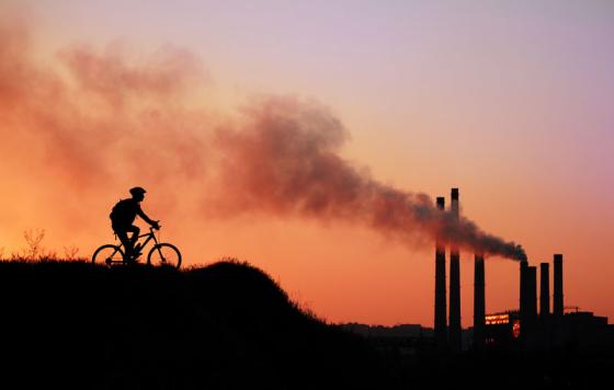 Sunset, powerplant, cyclist. Photo credit: Kalmatsuy / Shutterstock